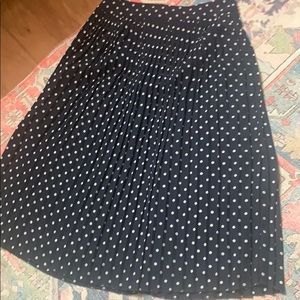 Pleated navy and white polka dot midi skirt
